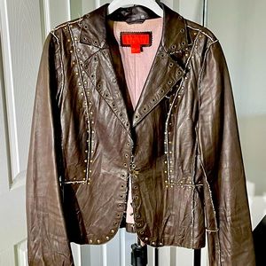Brown leather jacket with grommets